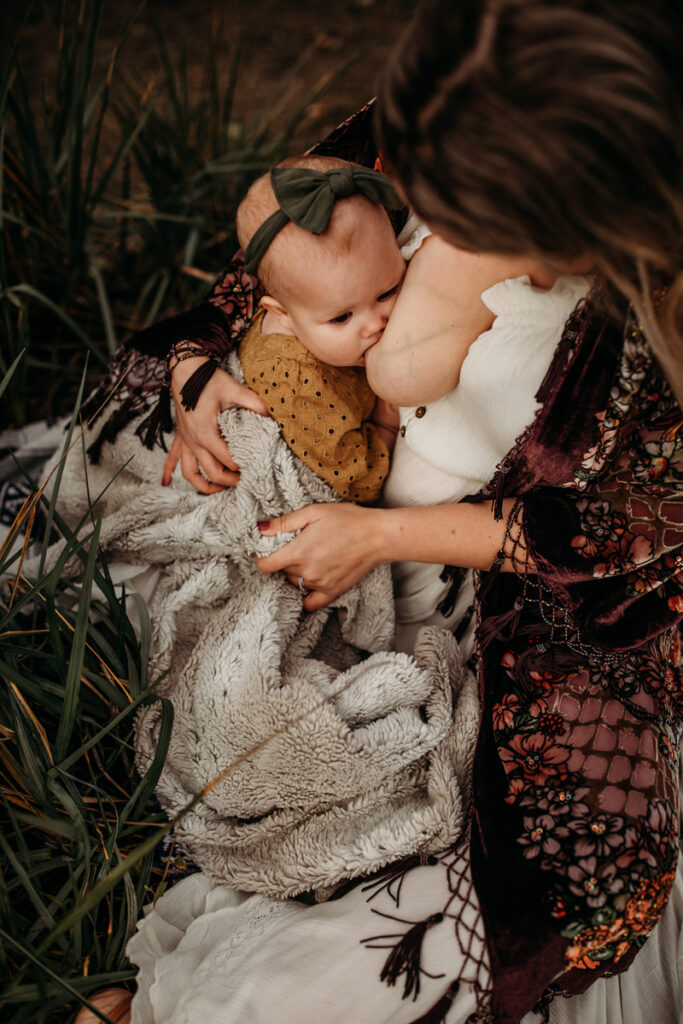 Maternity Photography, woman breastfeeding her young daughter